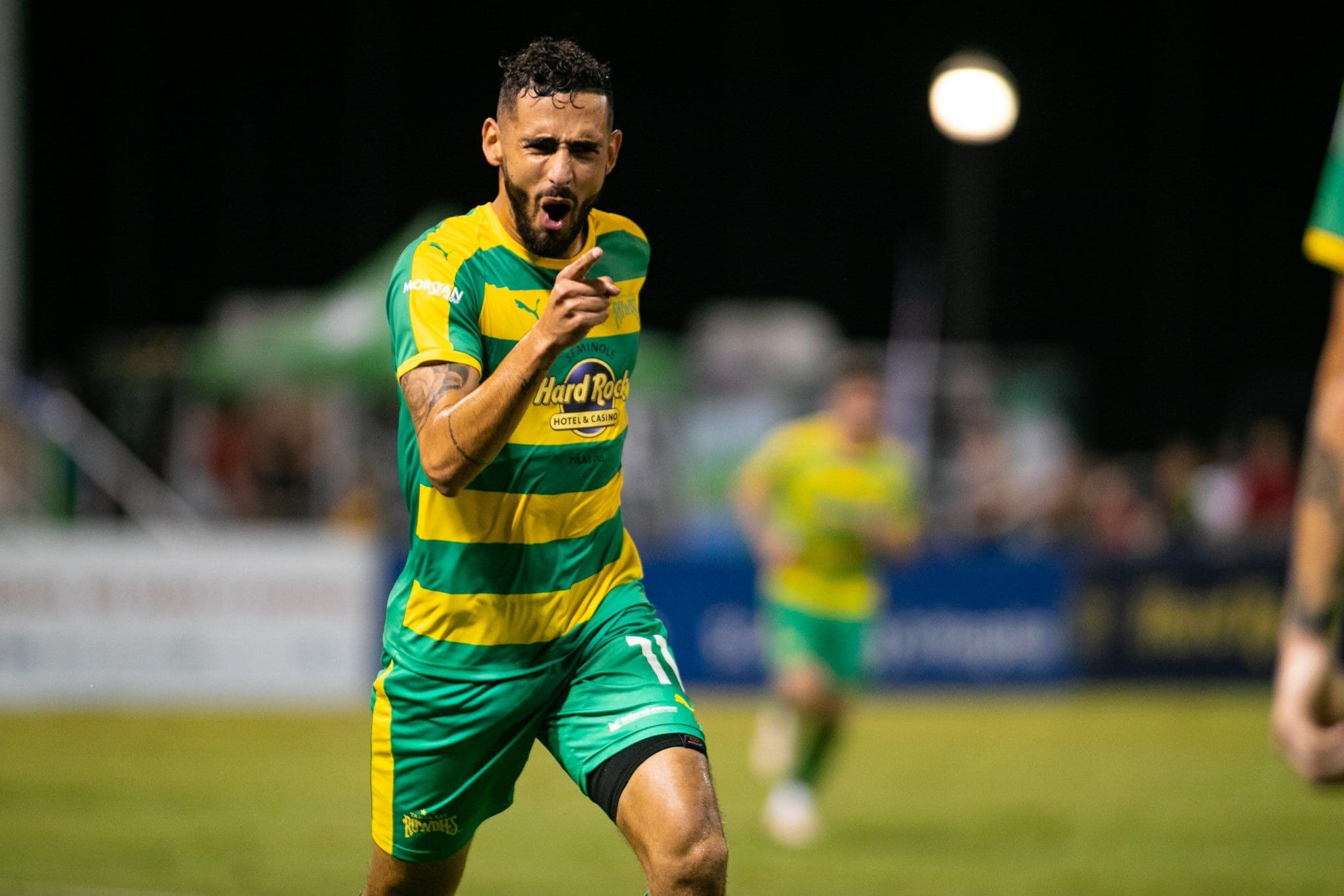 Leo Fernandes points to family during celebration