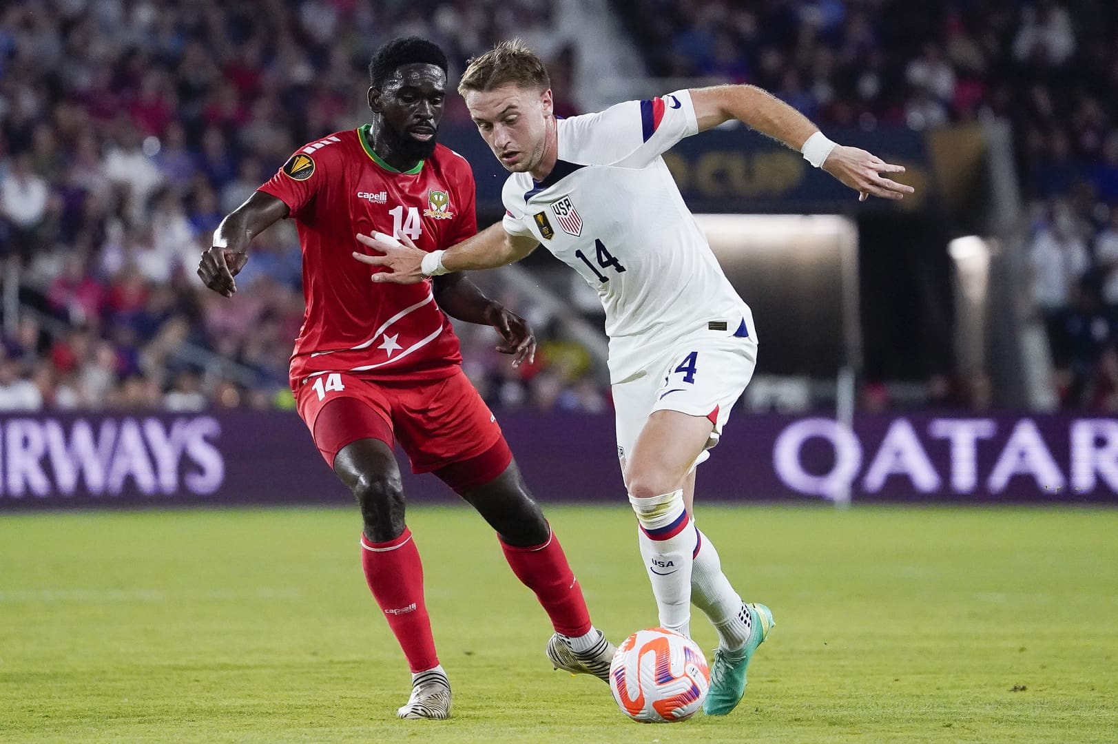 USMNT midfielder Djordje Mihailovic (#14) battles Saint Kitts and Nevis defender for possession during dominant 6-0 Gold Cup victory at CityPark