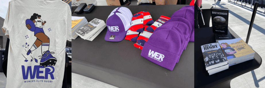 Merchandise display featuring Women's Elite Rugby items, including a t-shirt, hats, socks, and books about rugby.