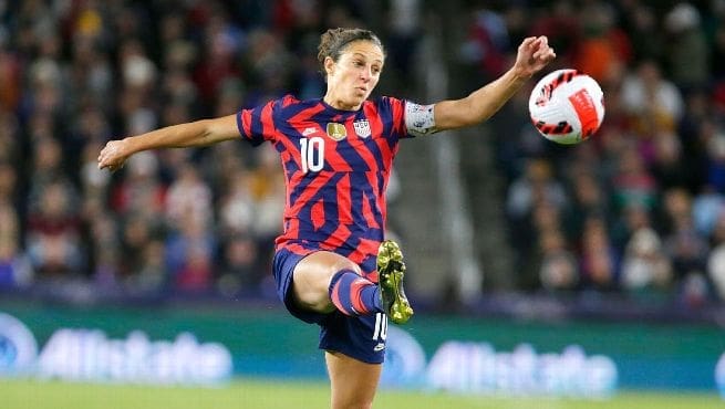 Carli Lloyd plays ball on the volley.