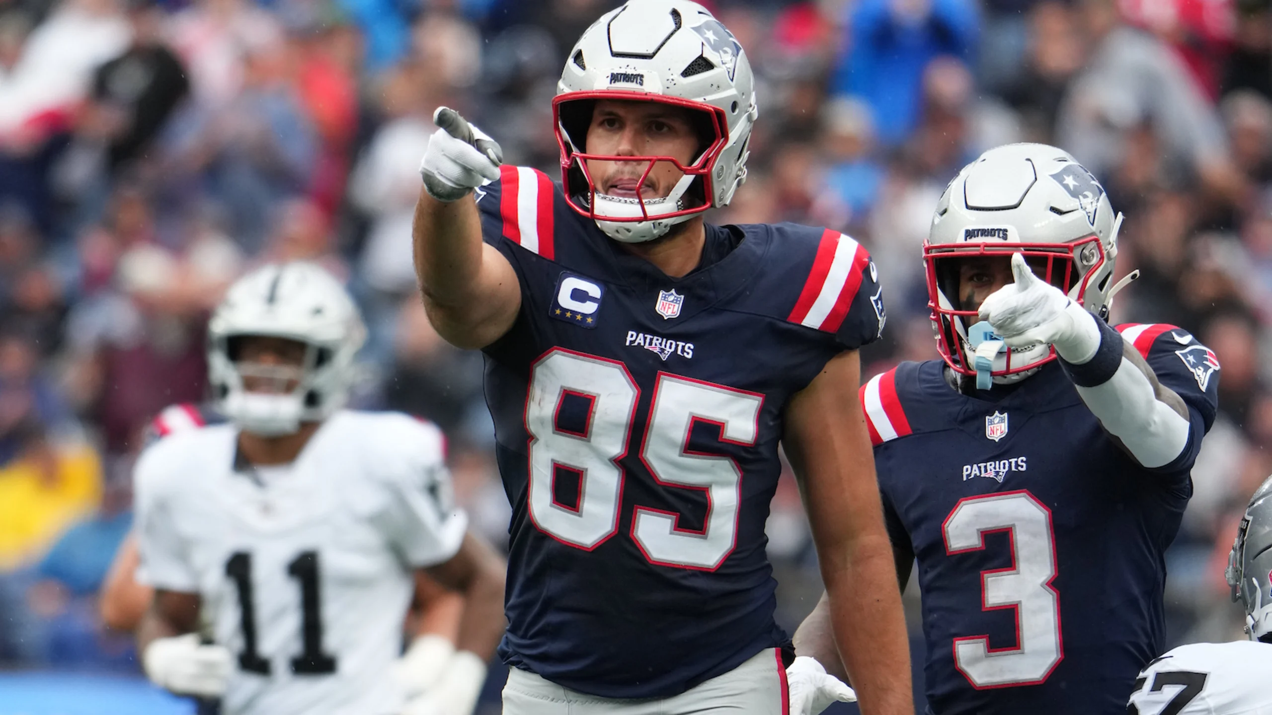 New England Patriots tight end Hunter Henry catches a pass during NFL game, celebrating his milestone 200th career reception