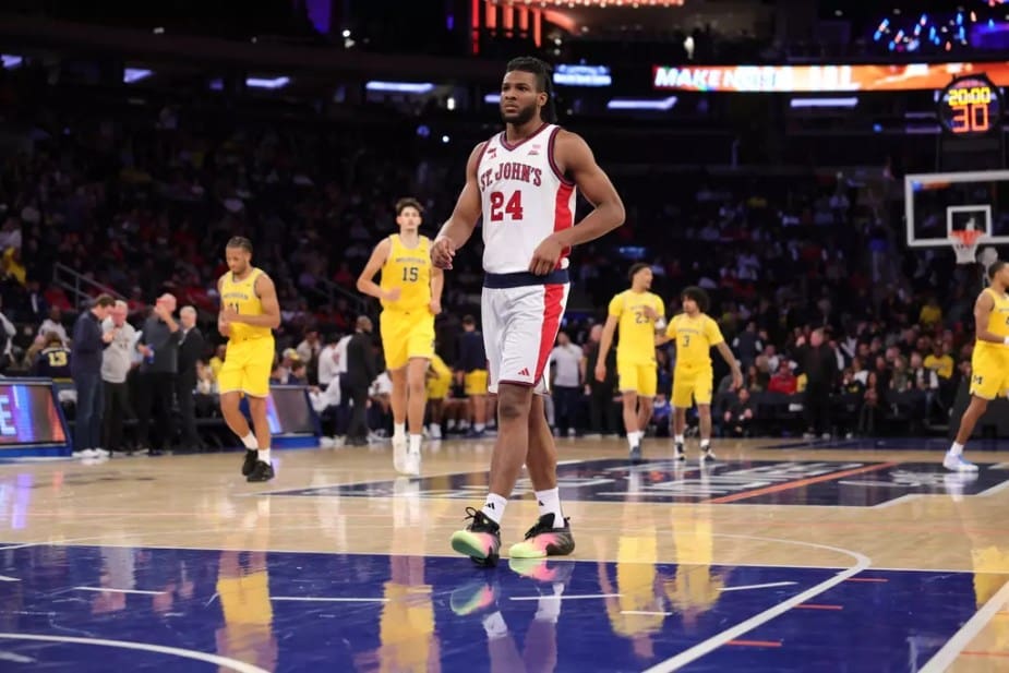 St. John's preseason BIG EAST Player of the Year Zuby Ejiofor flexes and celebrates after scoring against Michigan at Madison Square Garden on October 25, 2025