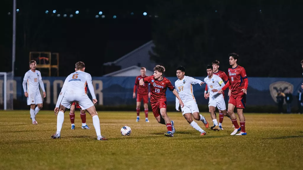 St. John's Red Storm men's soccer players celebrate together during NCAA Tournament First Round match against West Virginia at Dick Dlesk Soccer Stadium in Morgantown, W.Va., on November 20, 2025