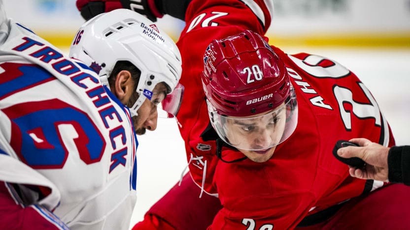 12/29/2025 Lenovo Center, Raleigh, NC., Vincent Trocheck wins the faceoff against Sebastian Aho Mandatory Credit: New York Rangers