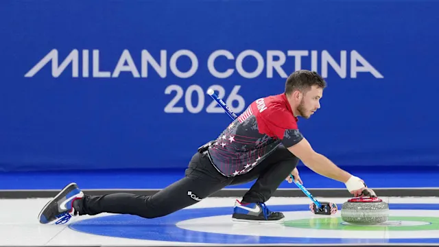 2/6/2026 Curling House, Cortina Bay, Italy, Korey Dropkin throws a big stone to earn three points in the 7th end. Mandatory Credit: Yahoo Sports, through Getty Images
