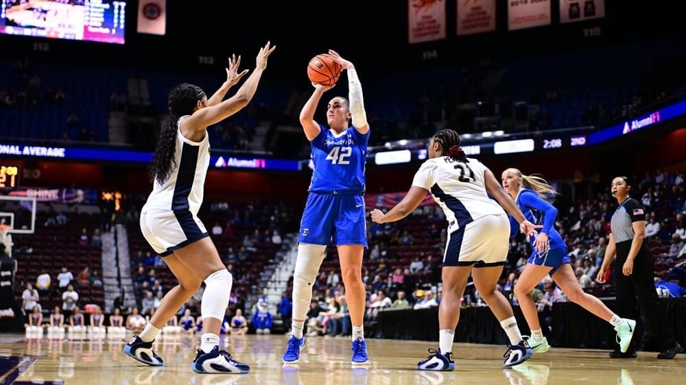Creighton’s Grace Boffeli rises for a mid‑range jumper over two Marquette defenders during the Big East quarterfinals at Mohegan Sun Arena. Mandatory Credit: Big East Conference.