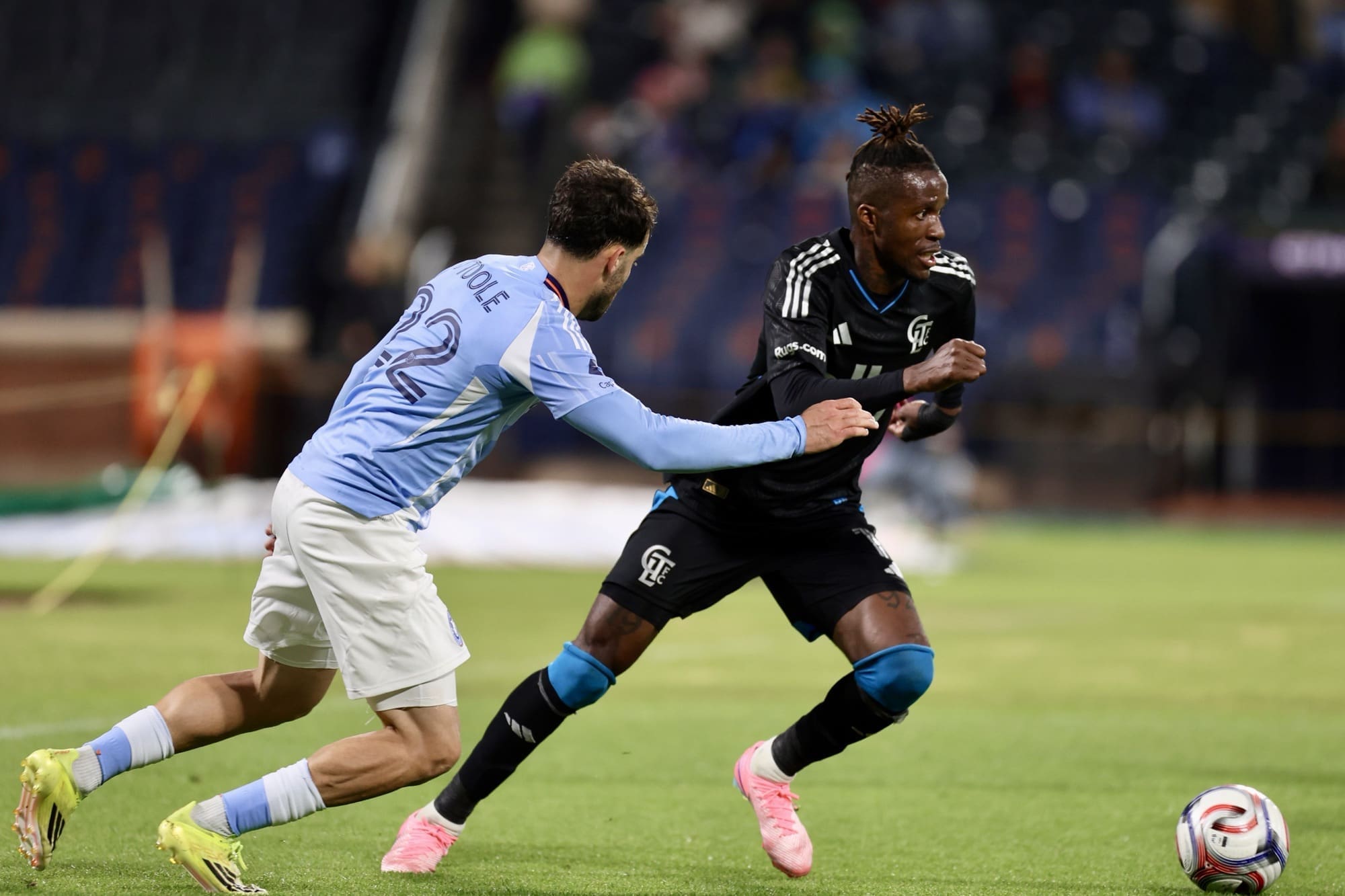 Kevin O'Toole is facing Wilfred Zaha trying to defend him.
