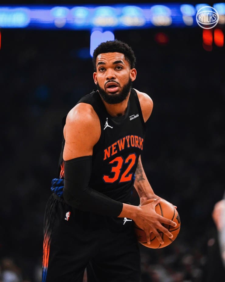 Karl Anthony Towns has the ball and is looking around