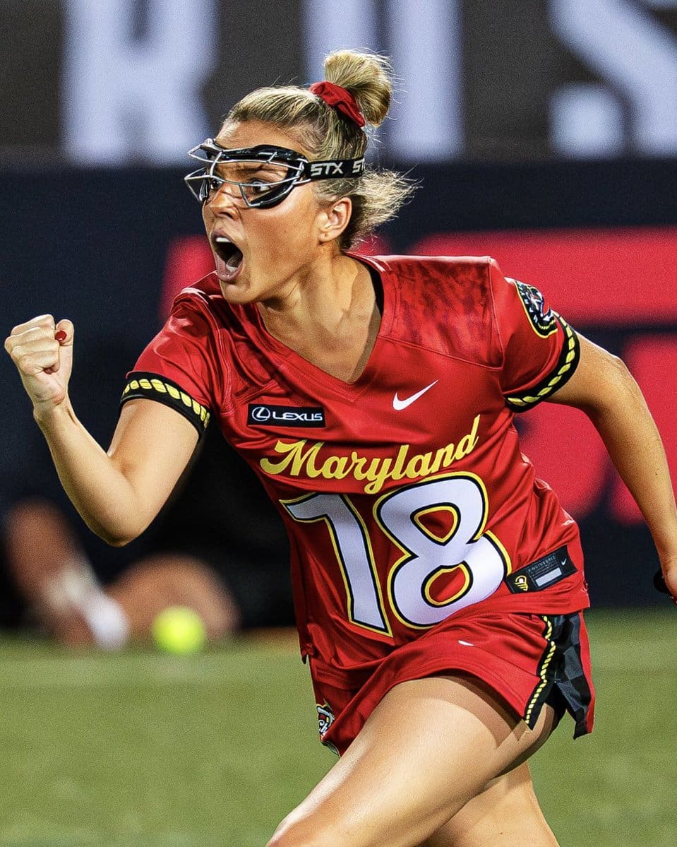 Ashley Humphrey celebrates after a goal. Wearing her home red jersey.
