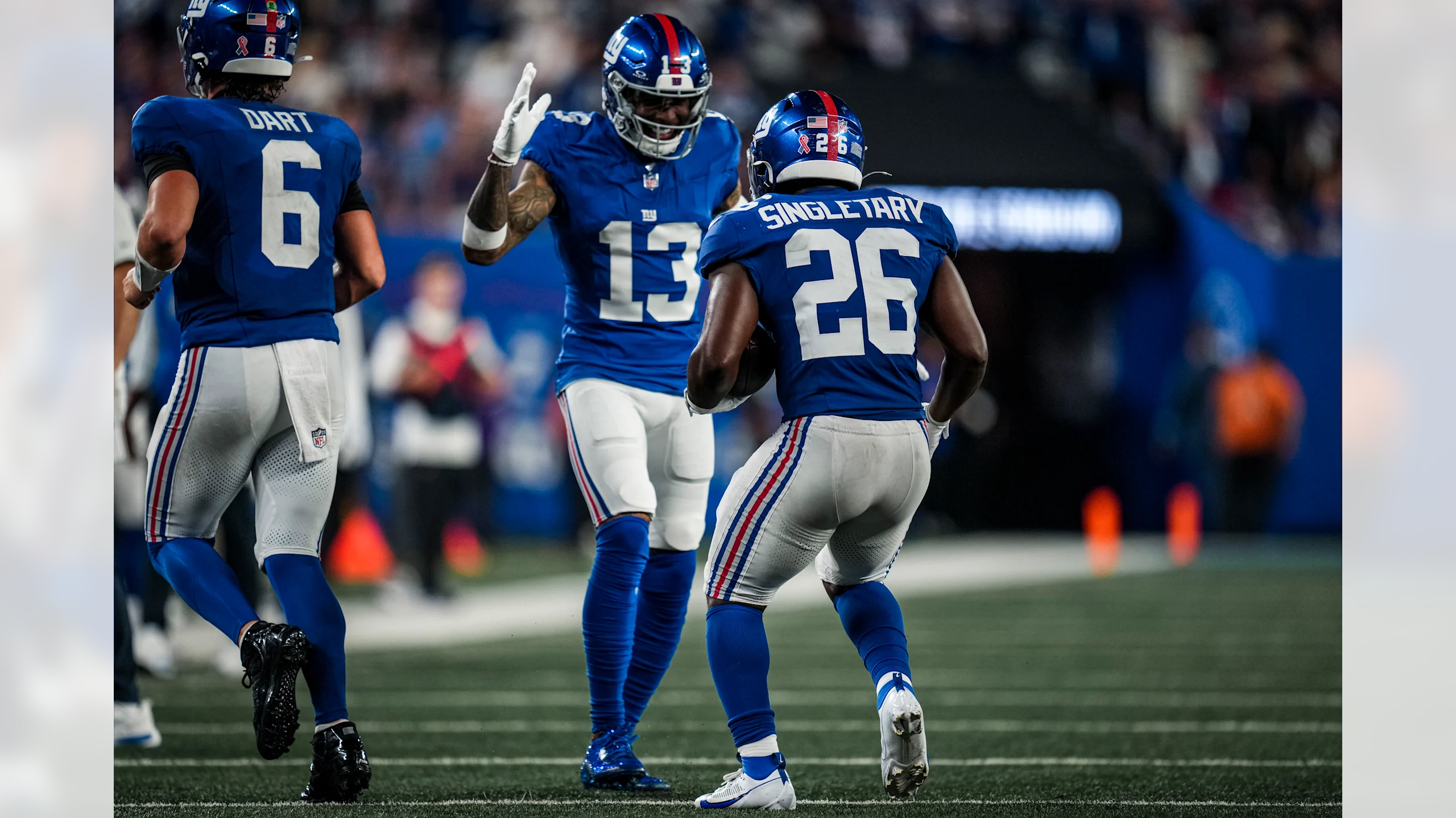 Dart running to the sideline and OBJ and Singletary celebrate a 9-yard receiving pass touchdown for the New York Giants.