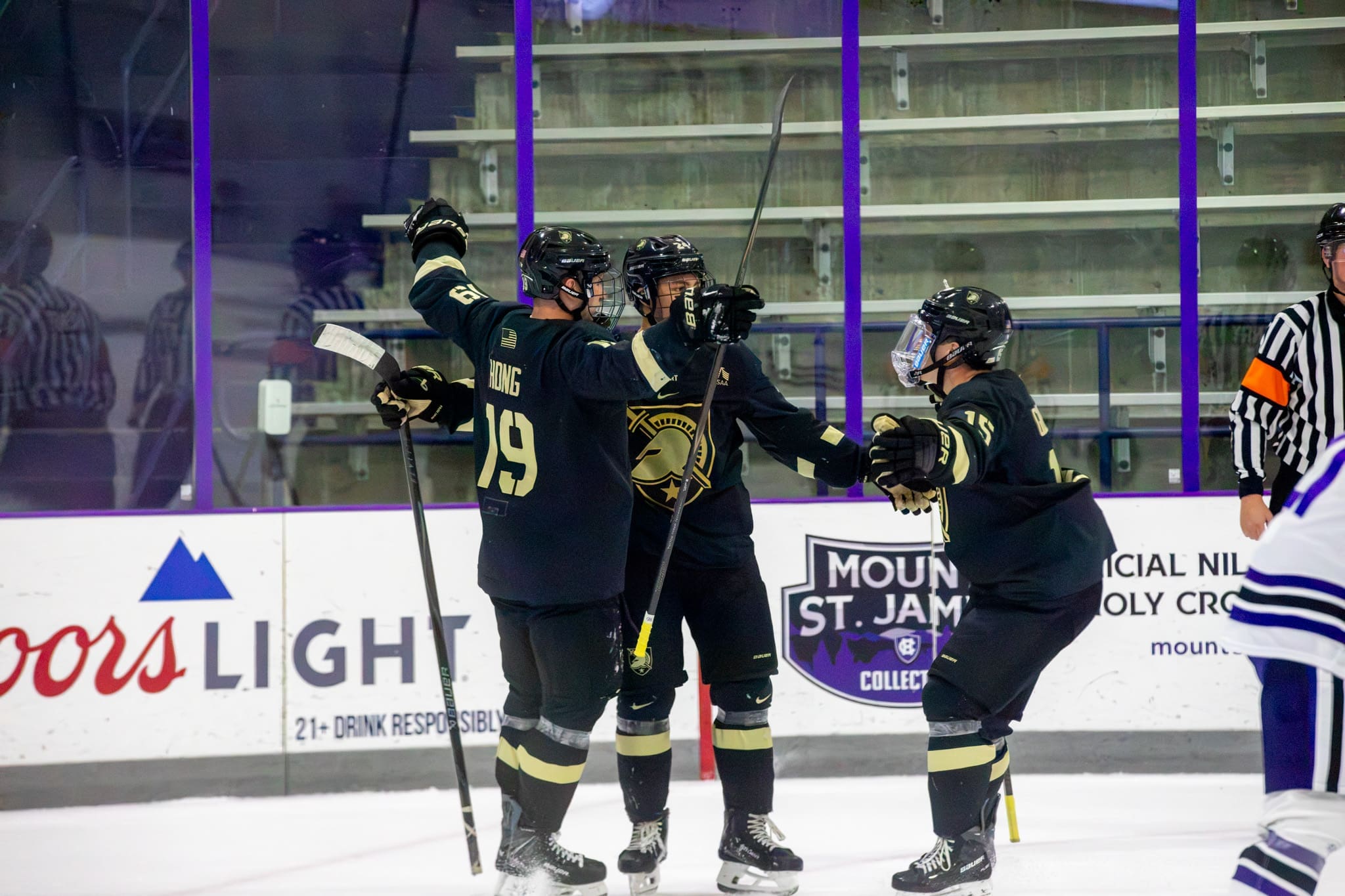 Nik Hong celebrating his first goal of the season with his linemates; 10/17/26; Photo Credit: Army Hockey
