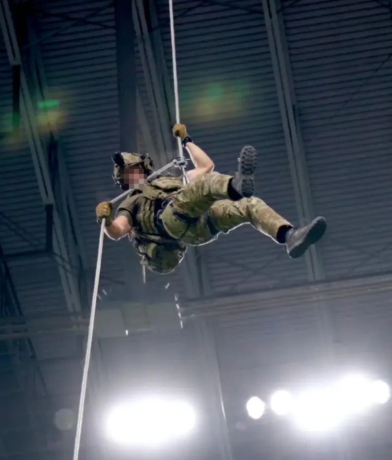Tech Sgt. Ian Patterson repelling down at UTSA vs Navy game.