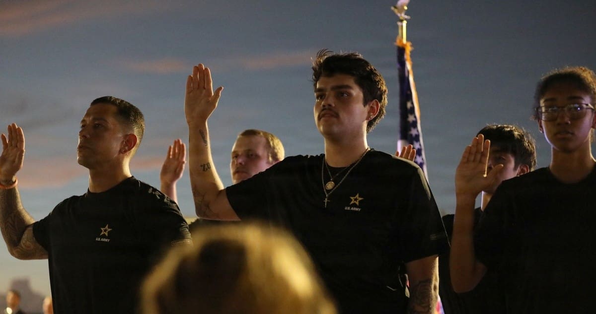 Future Soldiers joining the U.S. Army take the oath of enlistment Future Soldiers joining the U.S. Army take the oath of enlistment at a candlelight vigil honoring victims of the Sept. 11, 2001.