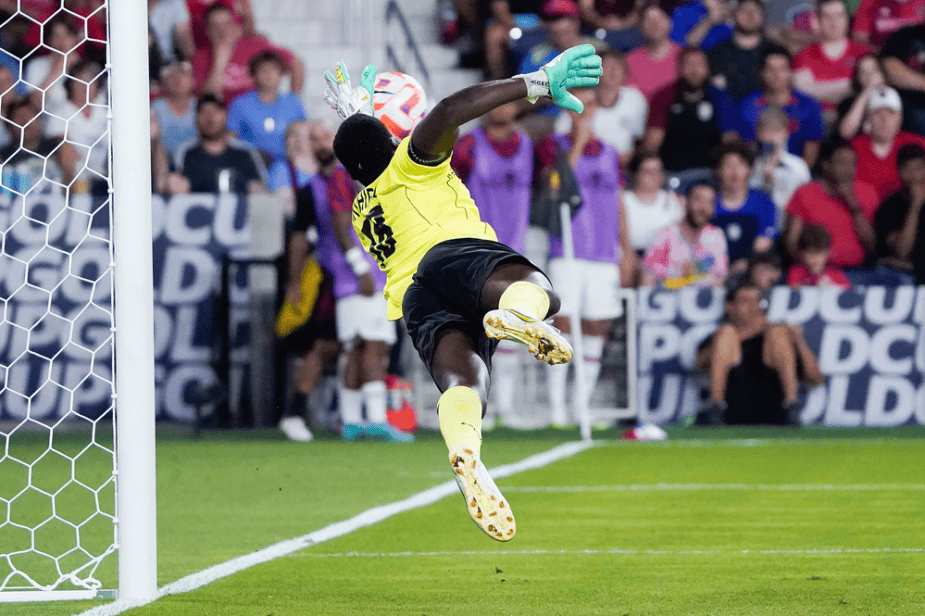 Diving Save by Saint Kitts and Nevis goalkeeper Julani Archibald on Jesus Ferreira of the U.S. Men's National Team.