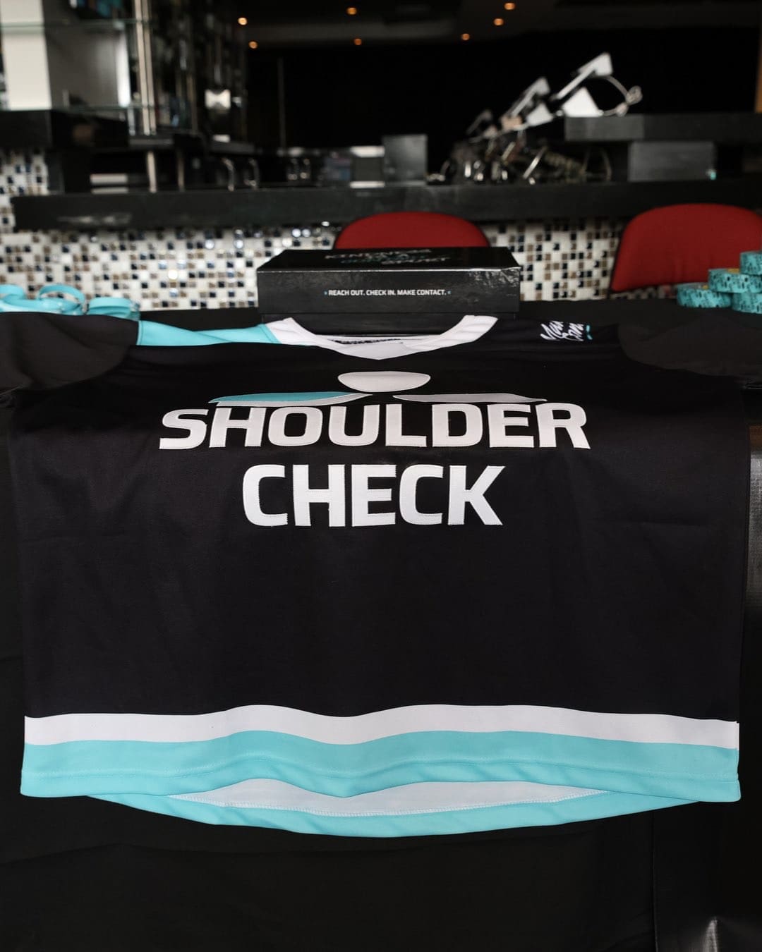12/29/24 Newark, NJ Prudential Center| Shoulder Check the sponsor of Mental Health Awareness Game for NY Sirens. Mandatory Credit: Bad Dawg Sports/PWHL