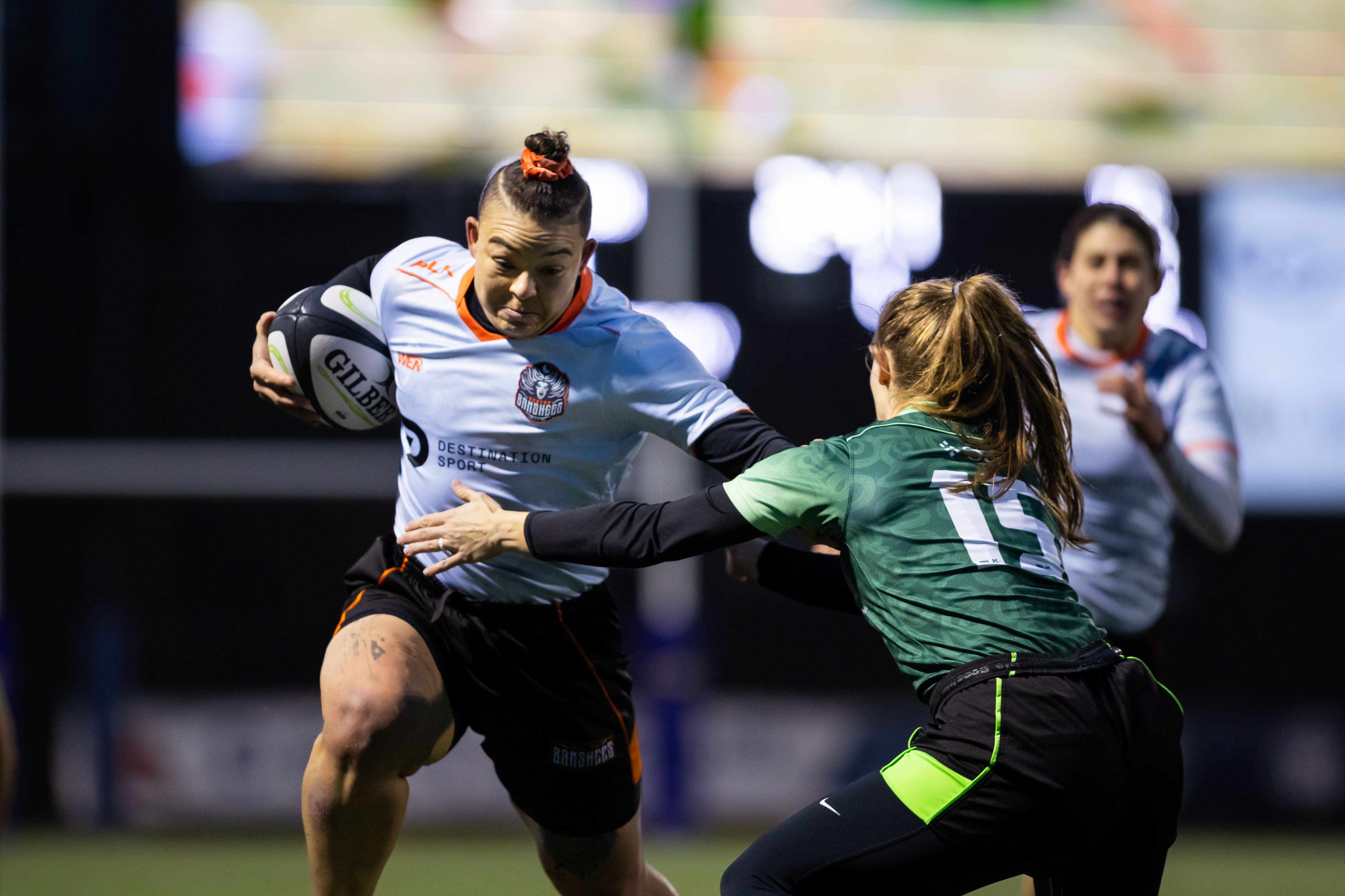 Banshees forward Yeja Dunn fends off Sam Black of the Gemini. Photo by Ali Tousignant via alitousiphotos.com.