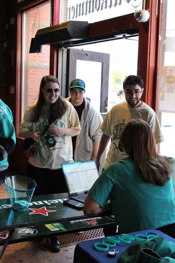 New York Sirens fans checking in at registration table for fan meet and greet event