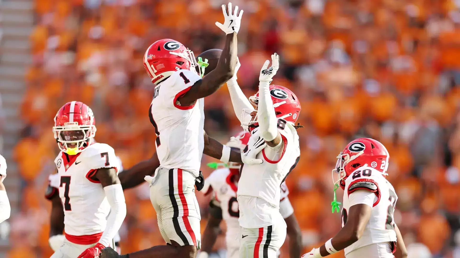 Georgia wide receivers Zachariah Branch (#1) and CJ Wiley (#6) celebrate a touchdown during the Bulldogs' thrilling 44-41 overtime victory over Tennessee at Neyland Stadium