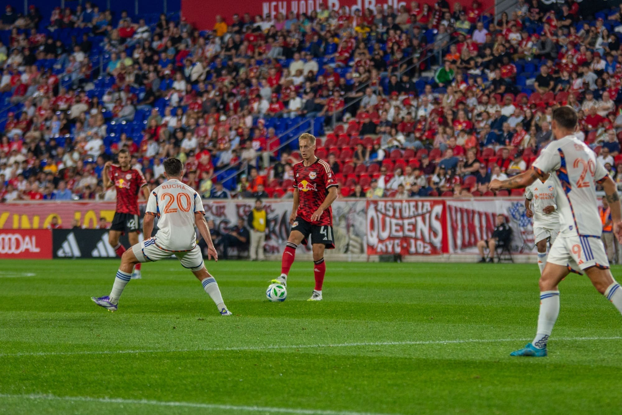 New York Red Bulls Swedish midfielder Gustav Berggren faces FC Cincinnati midfielder Pavel Bucha in a 1v1 situation during the Red Bulls' 0-1 loss at Sports Illustrated Stadium on October 4, 2025