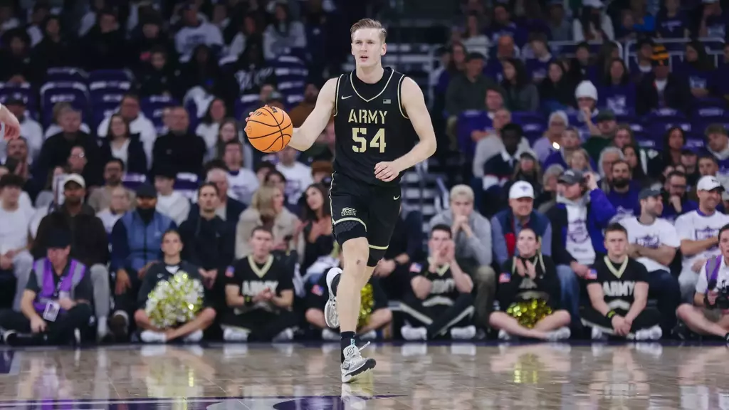 Army West Point sophomore forward Jorn Everson (#54) dribbles up court during the Black Knights' 76-83 loss to St. Thomas at Lee & Penny Anderson Arena on November 8, 2025