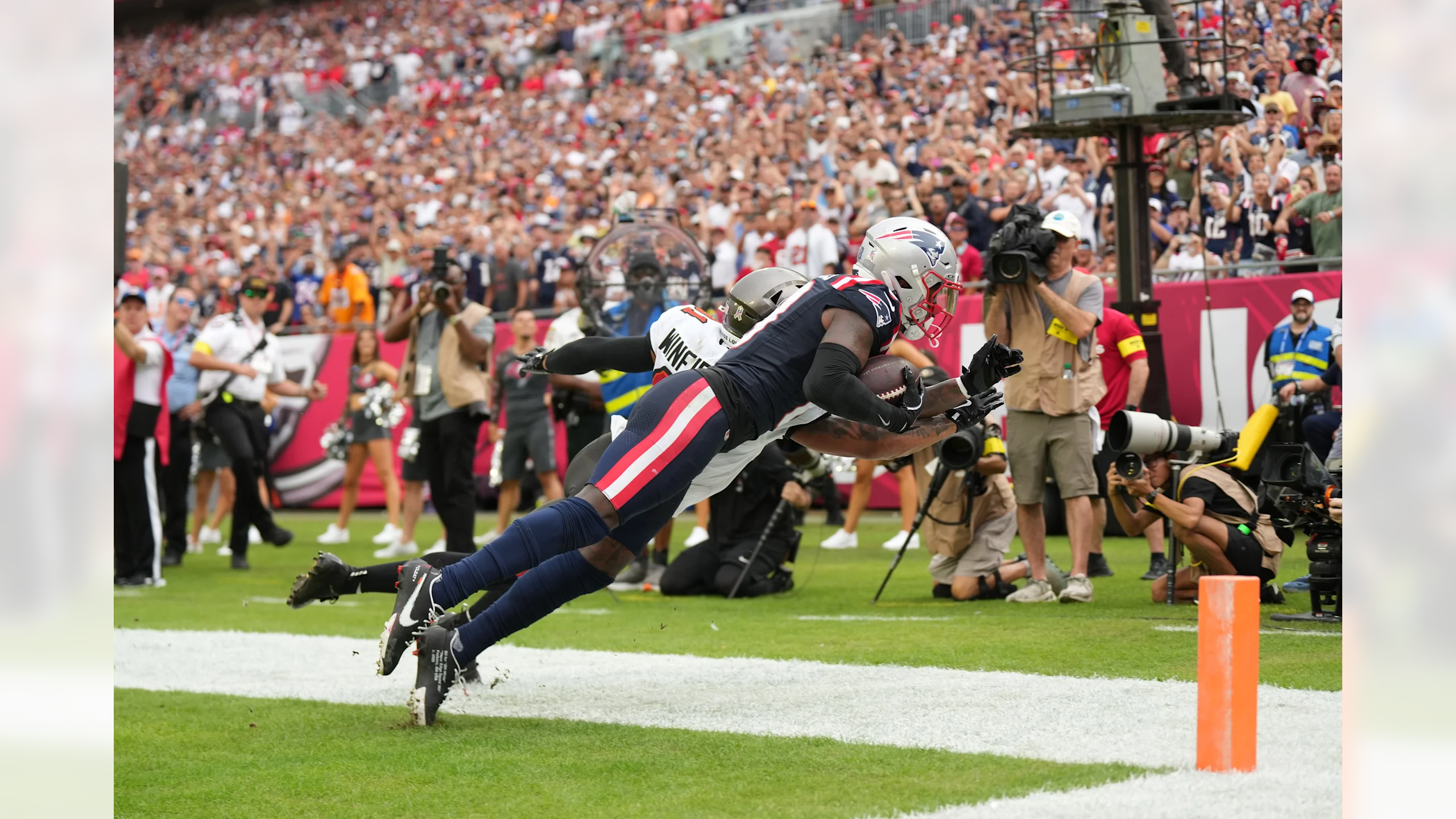 New England Patriots wide receiver Stefon Diggs makes a diving touchdown catch in the back corner of the end zone on fourth down with two seconds remaining in the first half against the Tampa Bay Buccaneers at Raymond James Stadium on November 9, 2025
