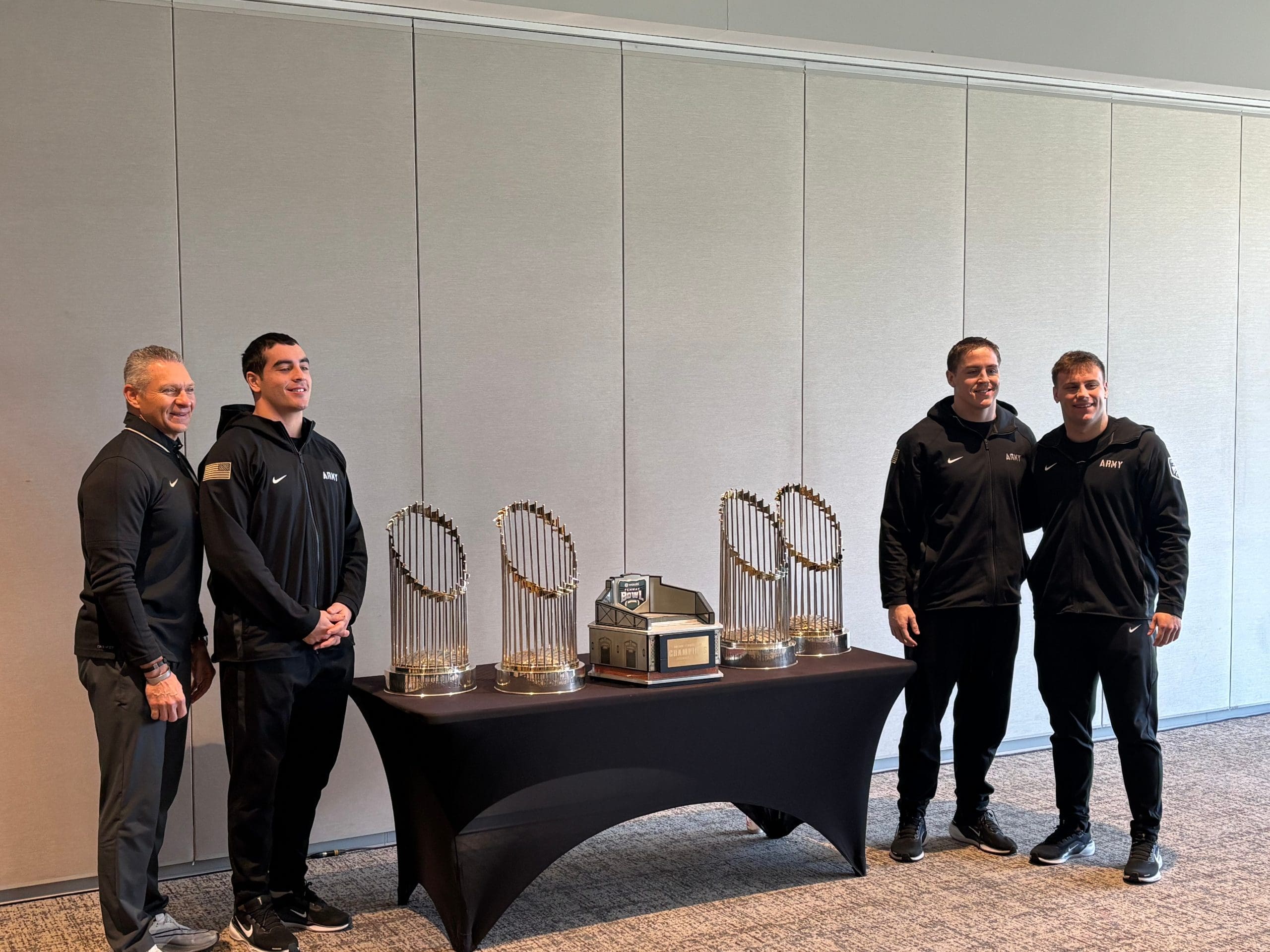 Army with the trophies after press conference. 