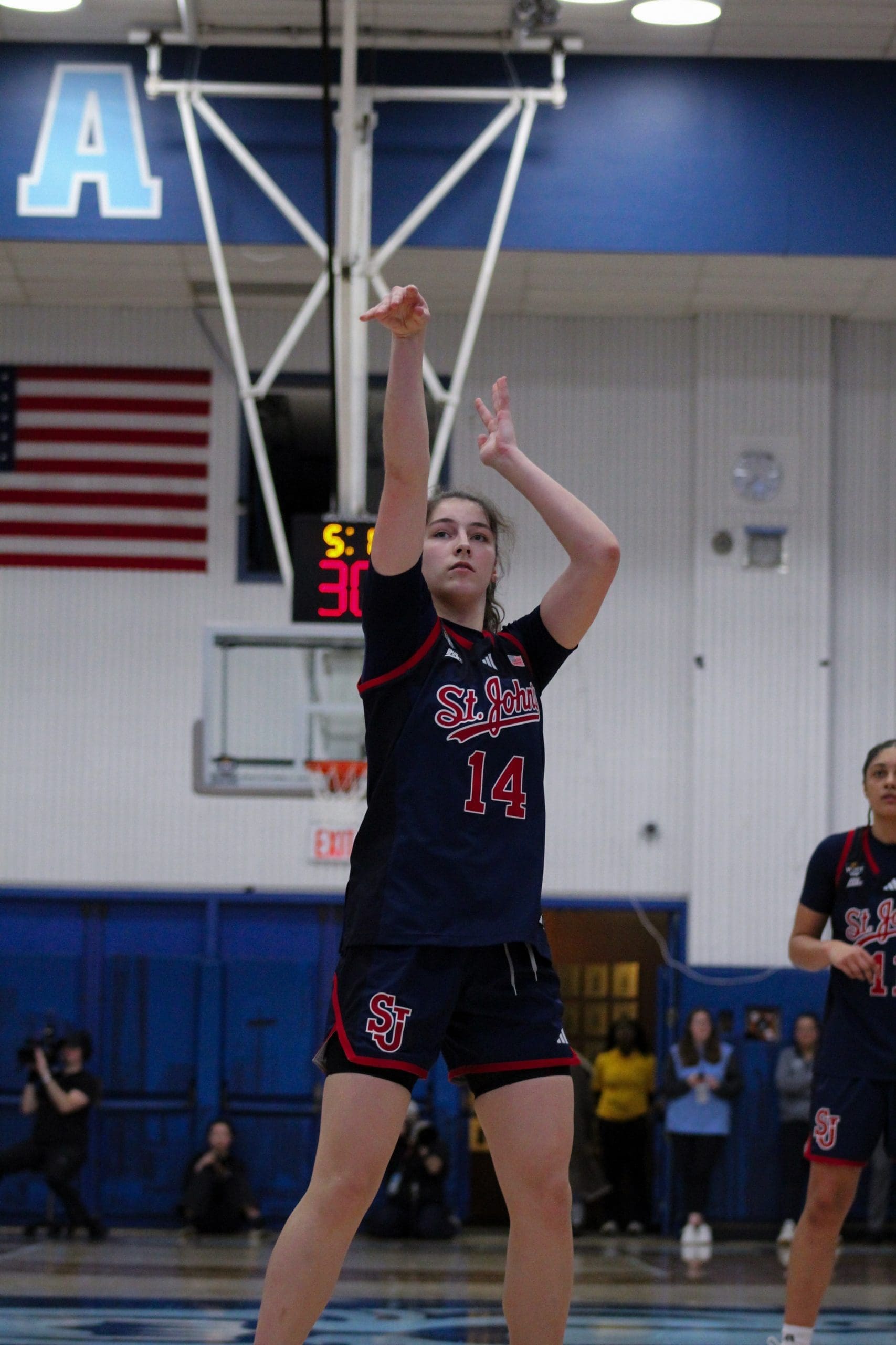 St. John’s forward Kylie LaVelle shoots a free throw while completing an and‑one during the WBIT game against Columbia.
