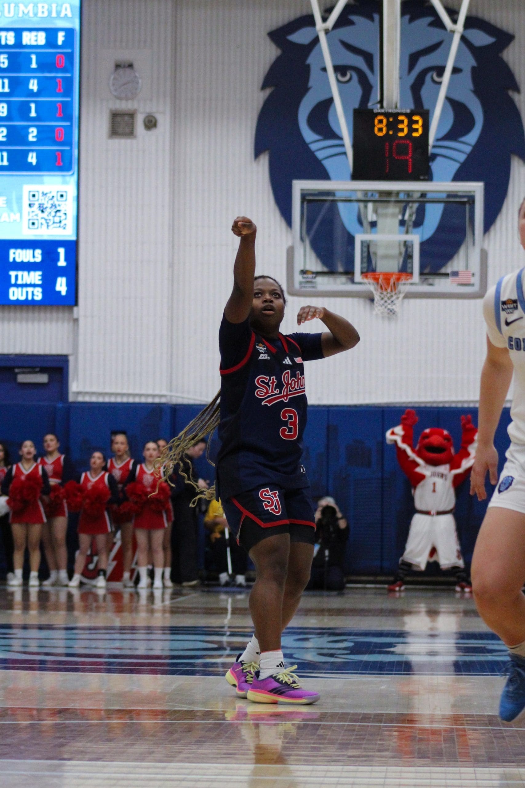 St. John’s sophomore guard shoots and makes a deep three‑pointer as the shot clock expires against Columbia.