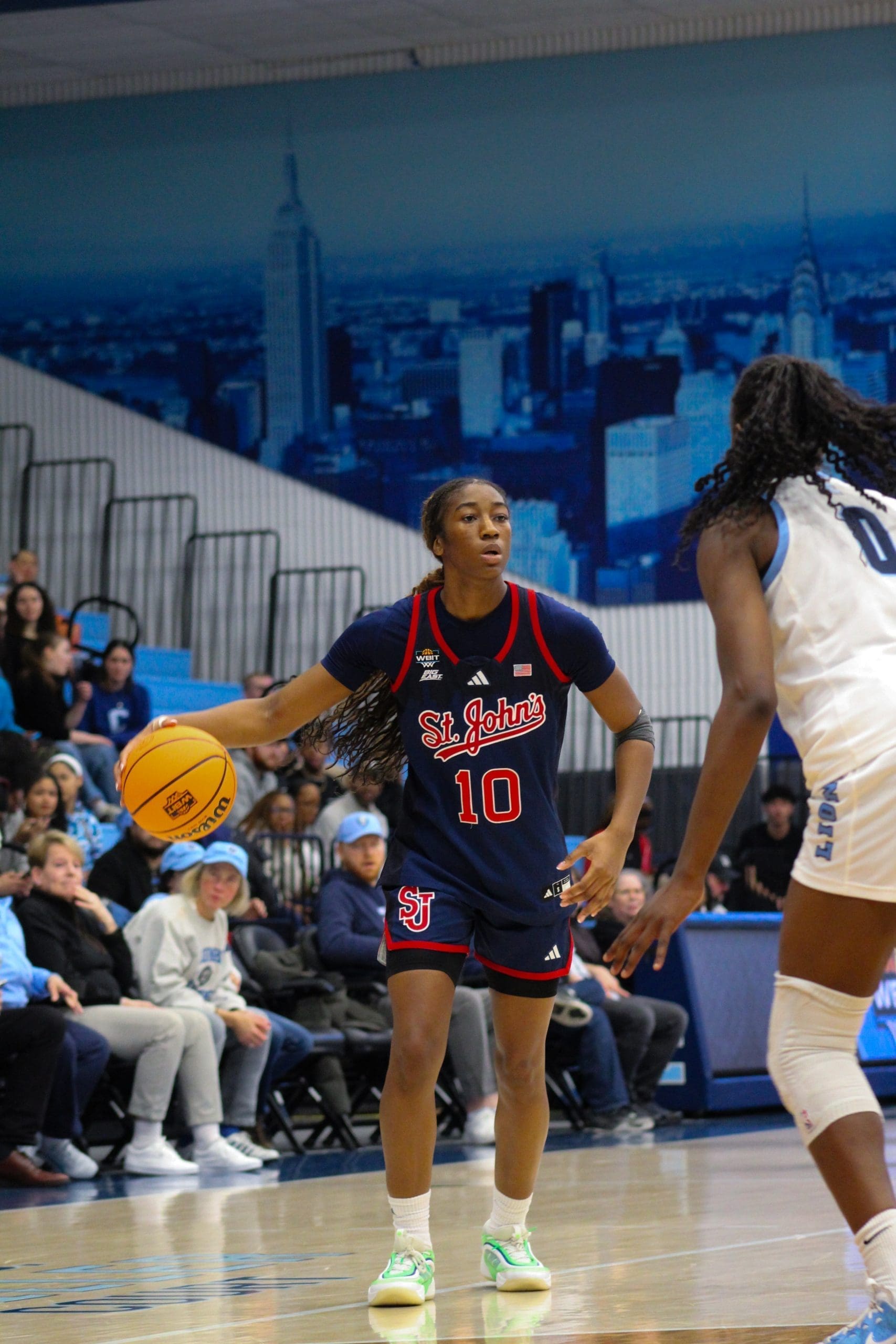 St. John’s guard Brooke Moore dribbles while looking for a teammate during the WBIT game against Columbia.