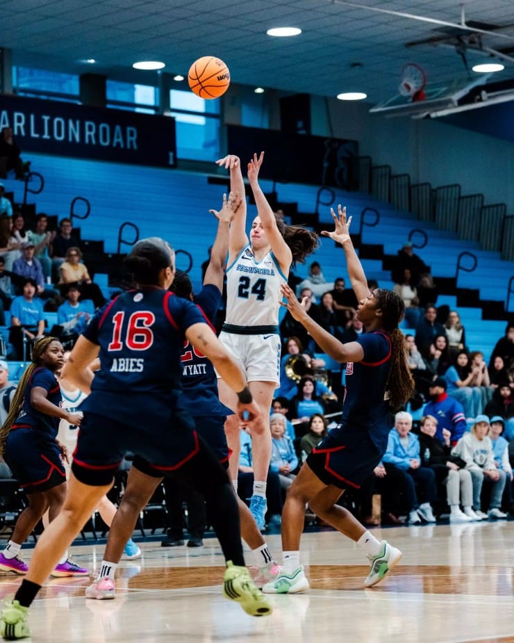 Columbia guard Riley Weiss rises for a long‑range jumper over the St. John’s defense during a WBIT game.