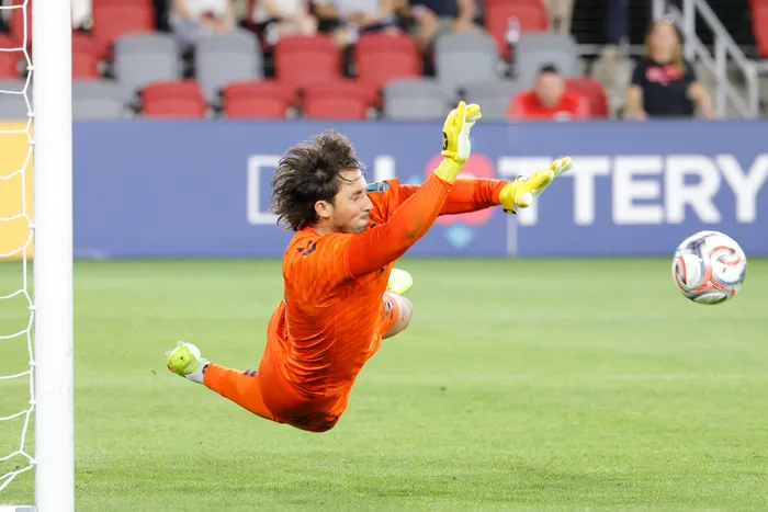 Jonathan Burke makes a big save for his club