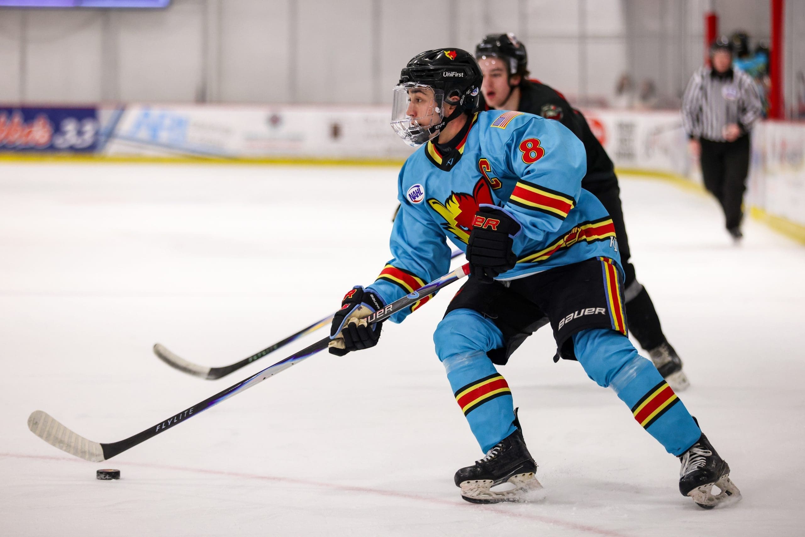 Sean Gibbons skating with the puck playing for the New Mexico Ice Wolves; Photo Credit: New Mexico Ice Wolves/Zach Price
