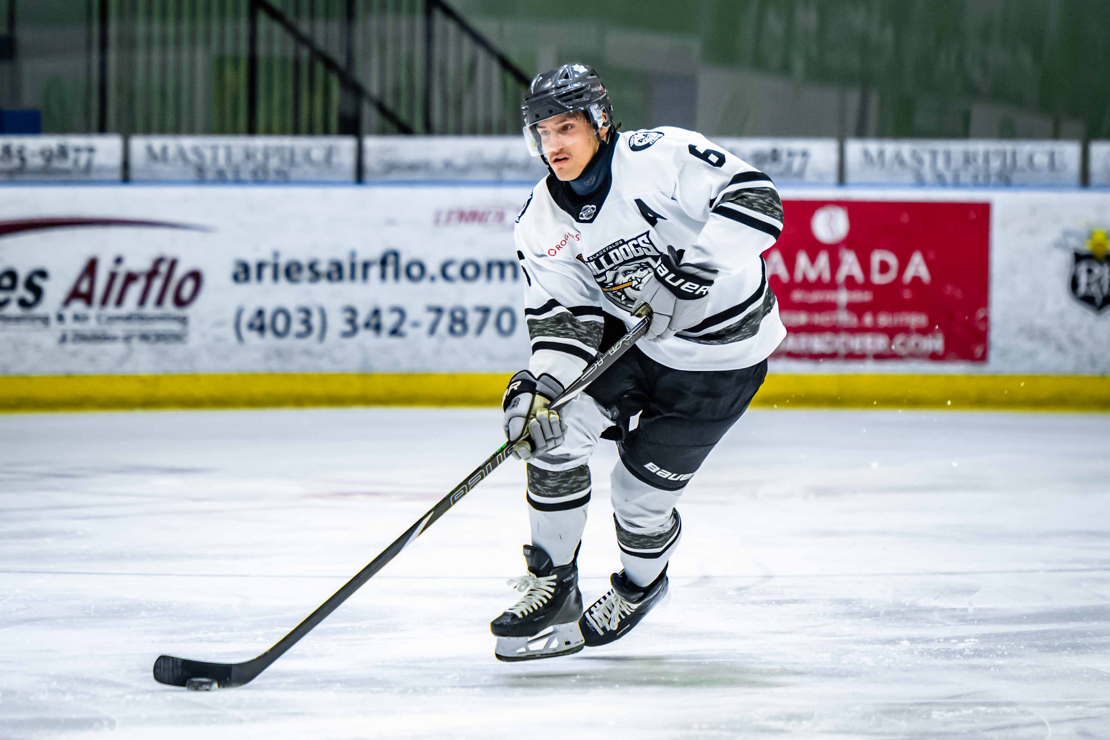 Alex Bosland skating with the puck for the Blackfalds Bulldogs; 04/03/26; Photo Credit: Tom Grimsdale/Ideal Images Red Deer