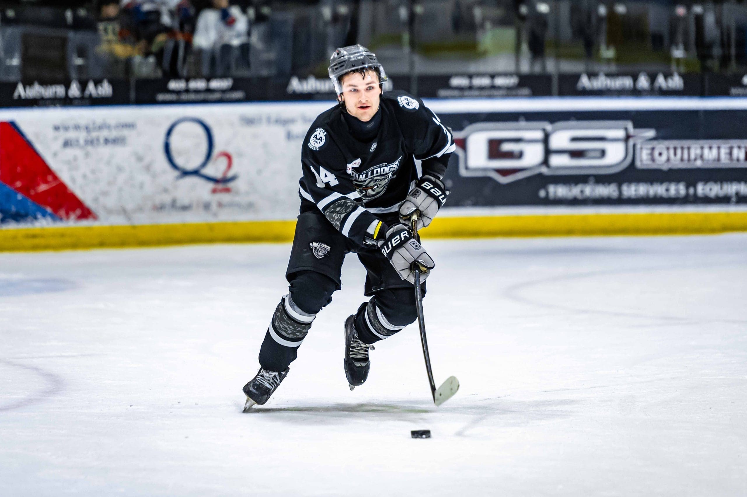 Thomas Neu skating with the puck  playing for the Blackfalds Bulldogs; 02/28/26; Photo Credit: Tom Grimsdale/Ideal Images Red Deer