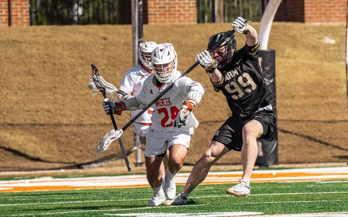 Army defender John Sullivan battles Mercer attacker Michael Frederick during a men’s lacrosse game in Macon, Georgia.