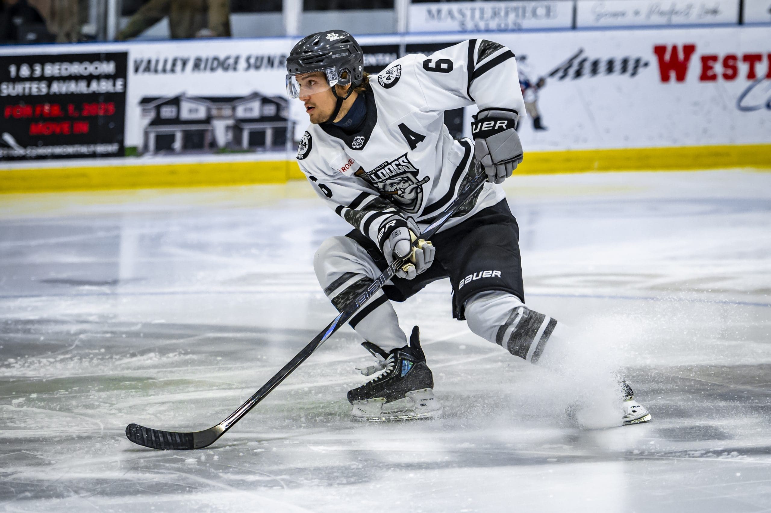 Alex Bosland skating with the puck for the Blackfalds Bulldogs; 11/07/25; Photo Credit: Tom Grimsdale/Ideal Images Red Deer