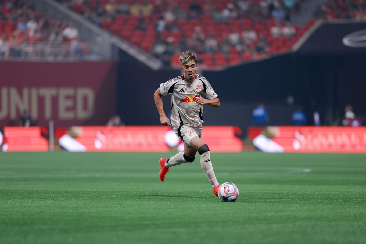 Matthew Dos Santos dribbles the ball